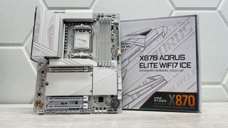 Gigabyte's X870 Aorus Elite WiFi7 Ice motherboard on a light desk with white background.