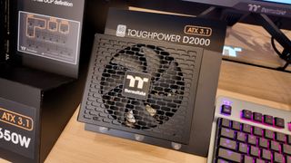 Two Thermaltake PSUs on show at CES 2025, one very large and the other very small.